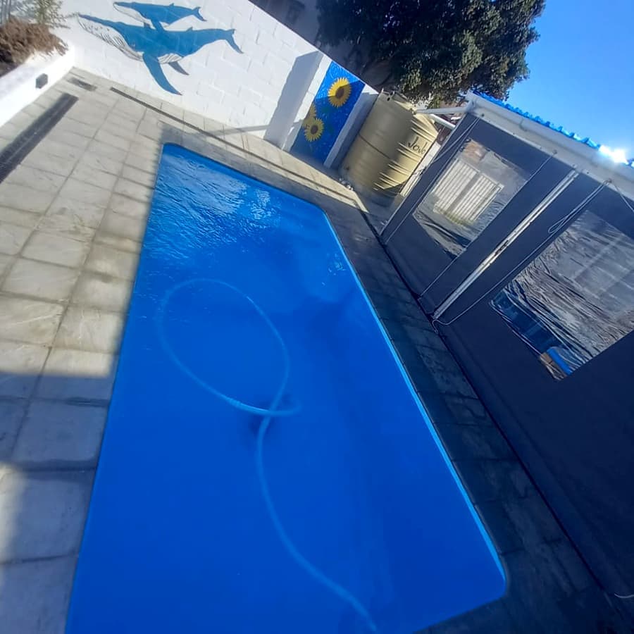 A pool restored to deep clear blue on a maintenance visit